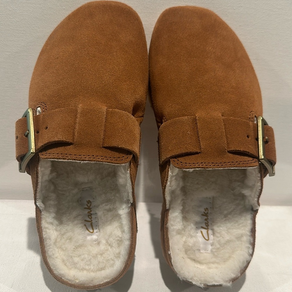 Clark’s Brookleigh Suede/Leather Mules with Sherpa lining and adj. buckle top.